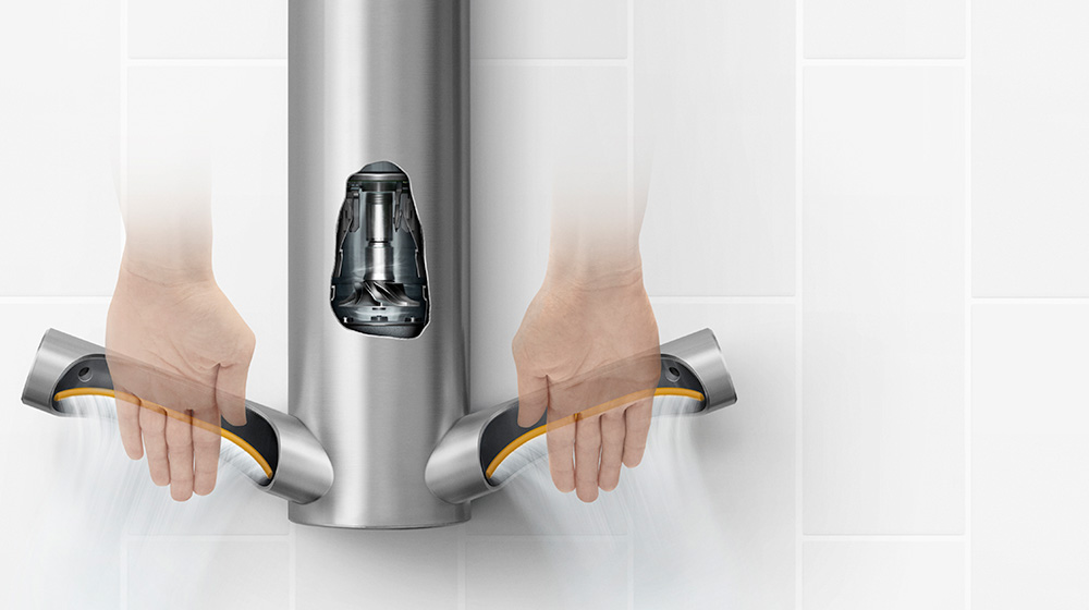 Model drying hands under the Dyson Airblade 9kJ hand dryer