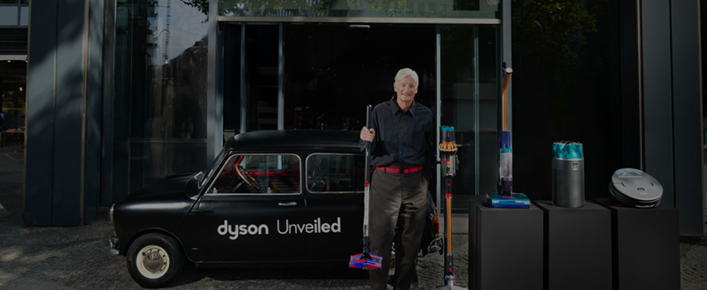 Sir James Dyson unveils the Dyson PencilVac cordless vacuum at an event.